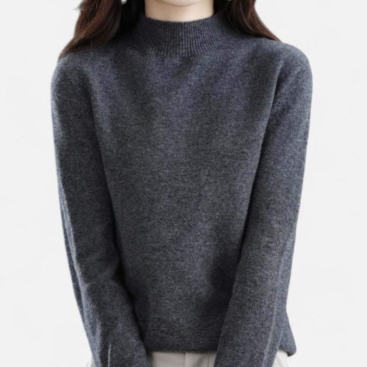 Close-up of women's dark grey mock neck knit sweater front view
