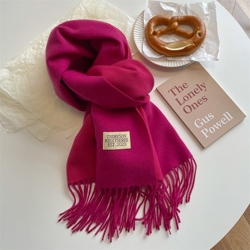 Close-up of winter accessories pashmina style scarf with fringes