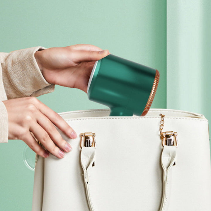 Ergonomic handle design of portable lint remover device