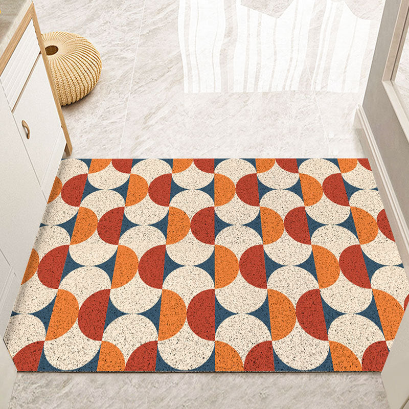 Vintage decorative doormat with retro geometric pattern in red placed in an entryway