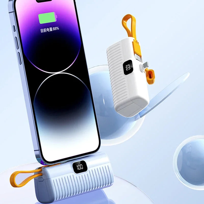 White portable power bank charging a smartphone on display stand