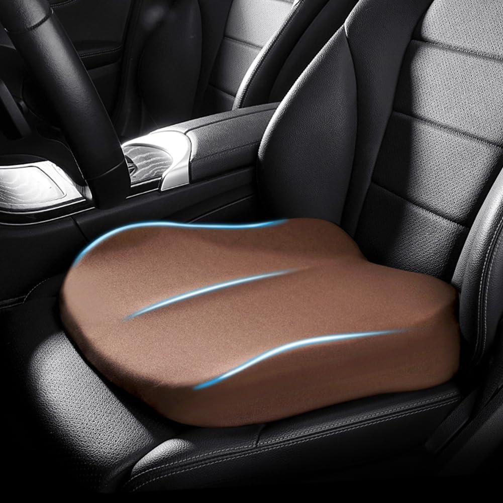 Brown memory foam car booster cushion installed on a vehicle seat
