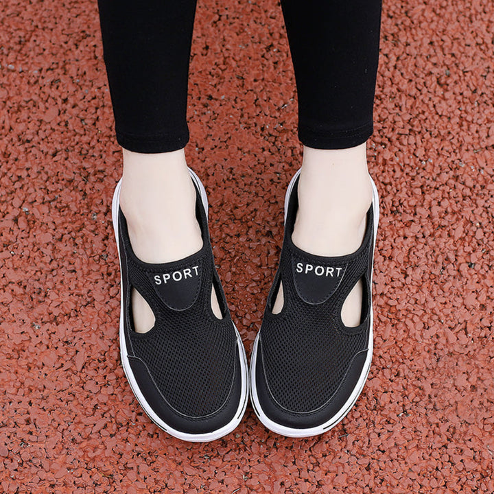 Top view of women's black mesh sneaker mules with sport lettering