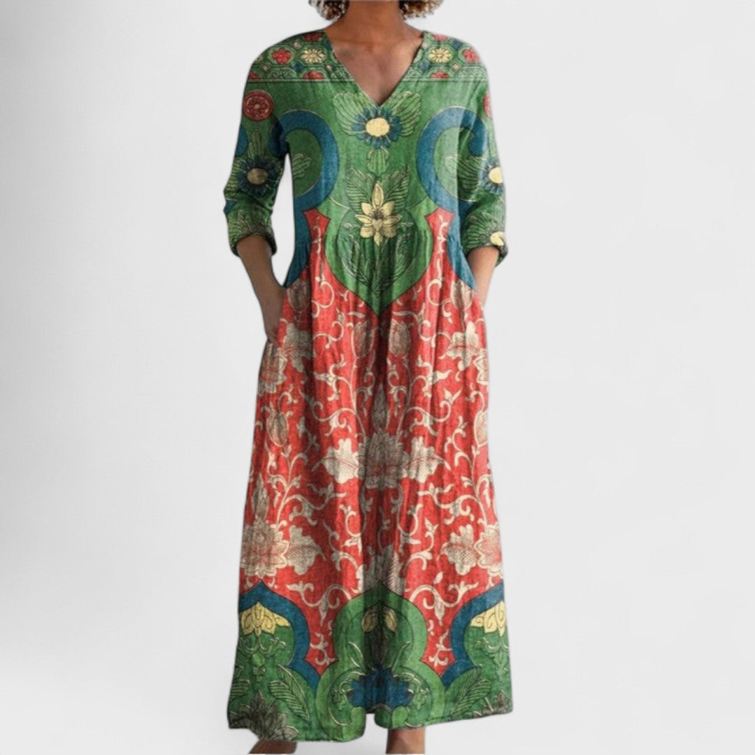 Model wearing a green vintage floral print maxi dress with three-quarter sleeves.
