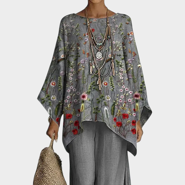 Close-up of the floral embroidered tunic top from the grey matching set