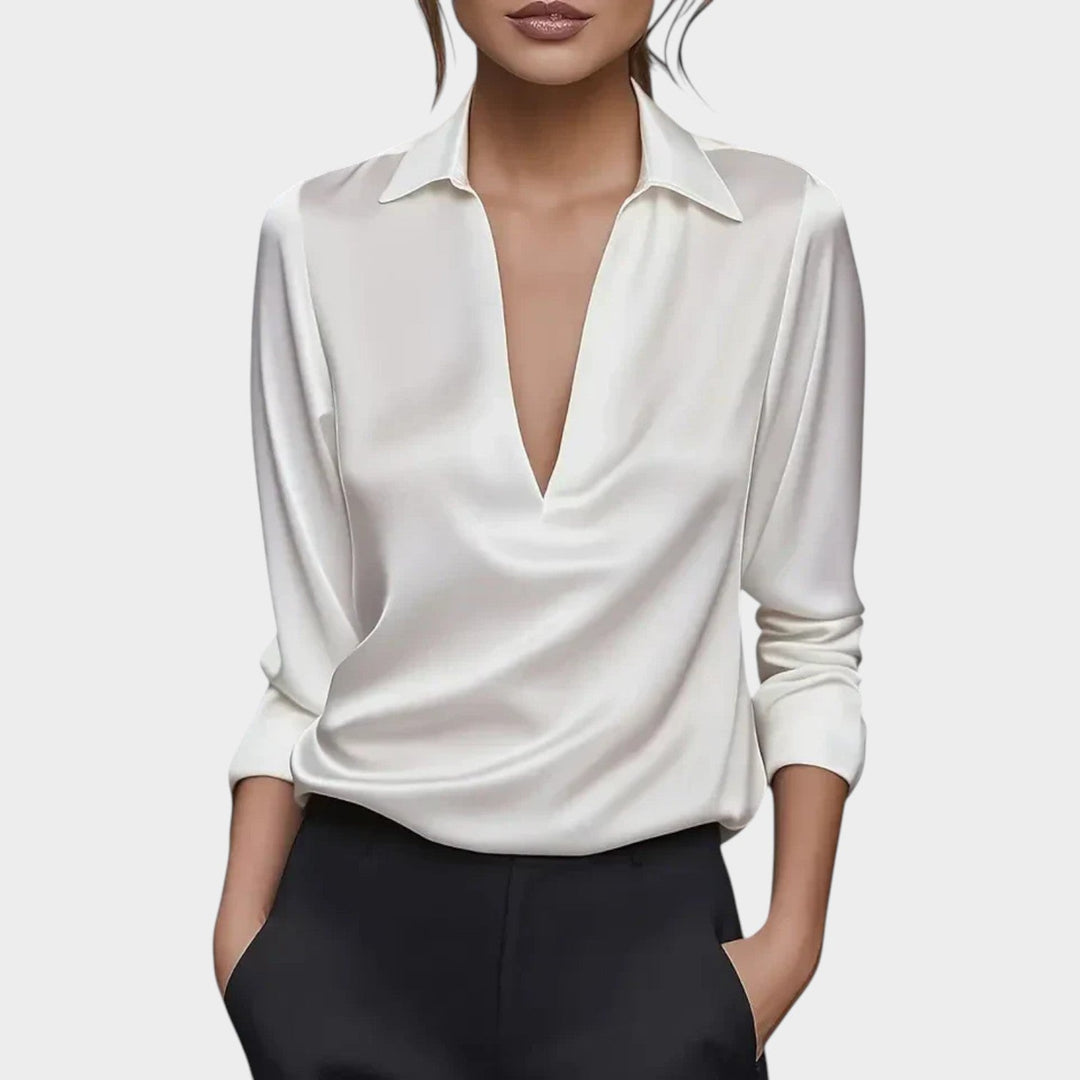 Woman wearing the crisp white V-neck classic collar blouse