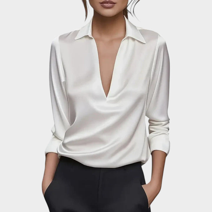 Woman wearing the crisp white V-neck classic collar blouse