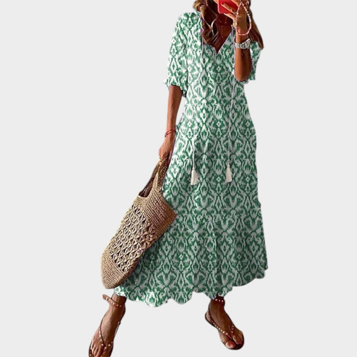 Woman wearing green patterned boho maxi dress for summer