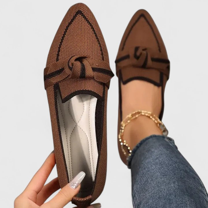 Brown pointed-toe knot loafers featuring a sleek silhouette