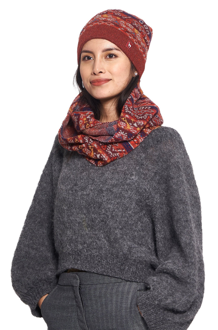 Red women's jacquard knit winter beanie close-up showing texture
