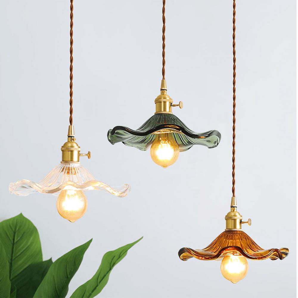 Three colorful hibiscus pendant lamps in green, transparent white, and brown crystal hanging together