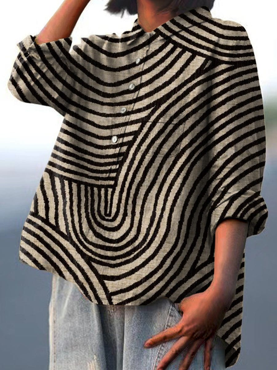 Woman wearing stylish black abstract pattern long sleeve blouse