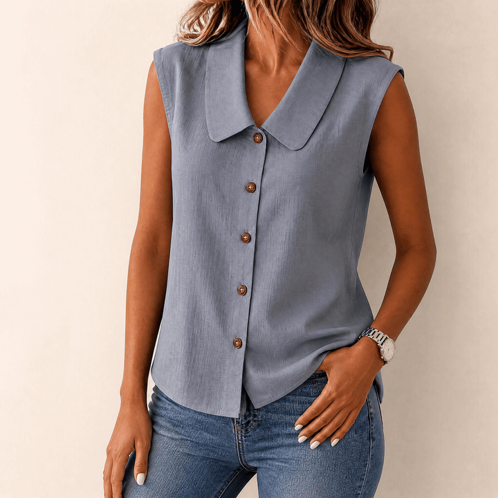 Detailed shot of button placket on sleeveless collared summer top