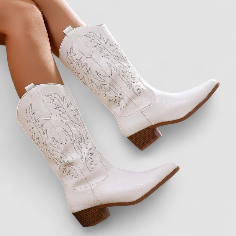 Close-up of pointed toe and traditional embroidery on stylish women's western footwear