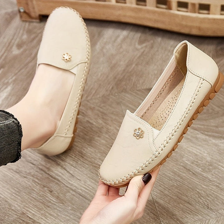 Close-up shot of the soft textured fabric and stitching details on the women's casual footwear.