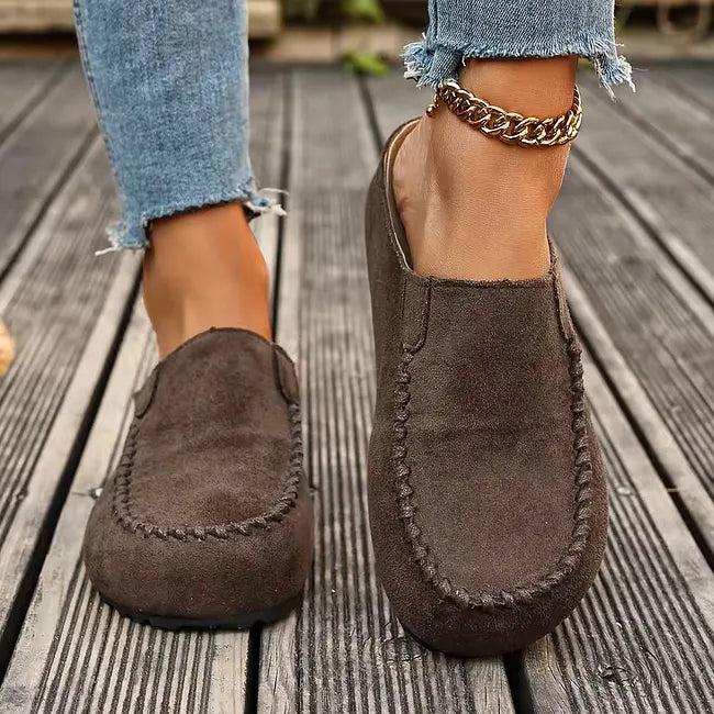 Women's slip-on orthopaedic sandals showing comfortable flat moccasin design