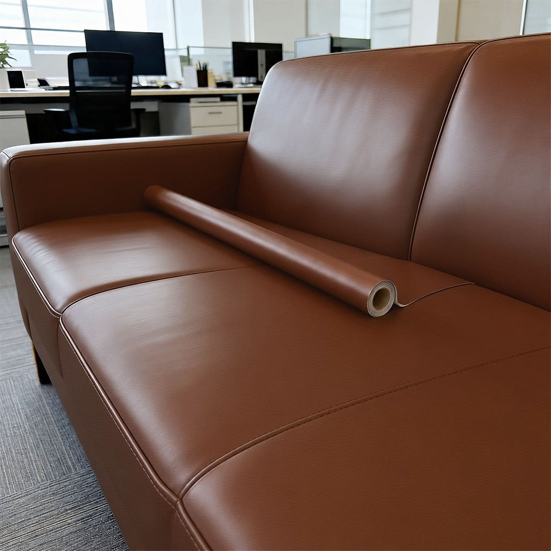 Vinyl repair patch applied on damaged sofa surface for seamless upholstery fix