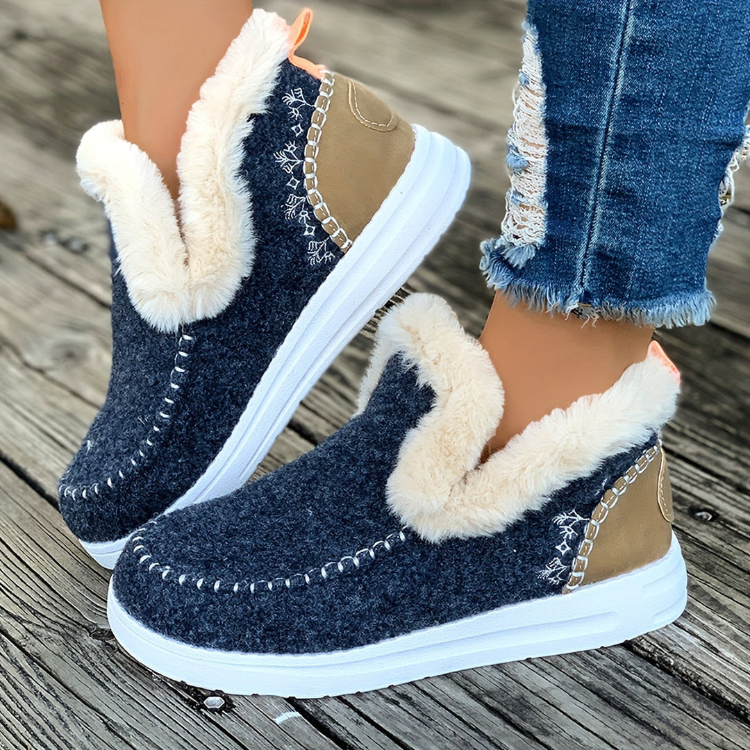Women wearing marine blue warm winter slippers with plush lining outdoors