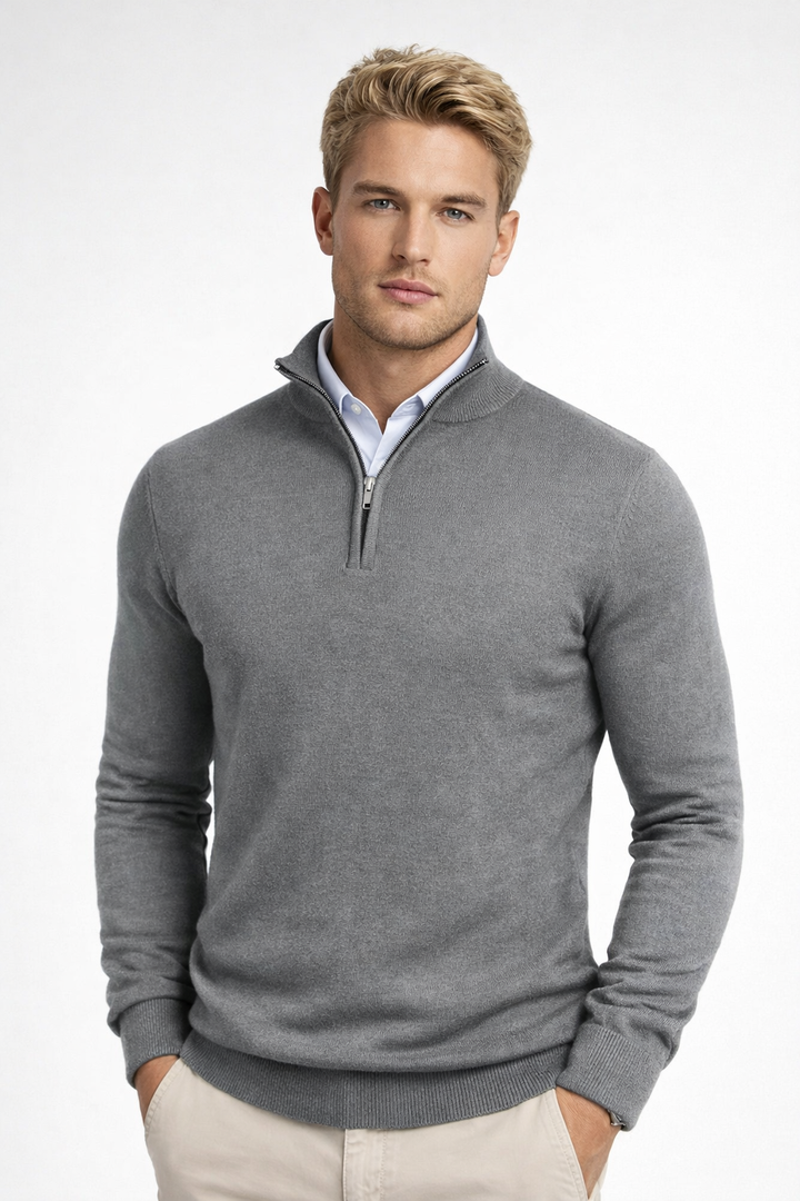 Close up fabric texture of mens wool blend half zip knitwear