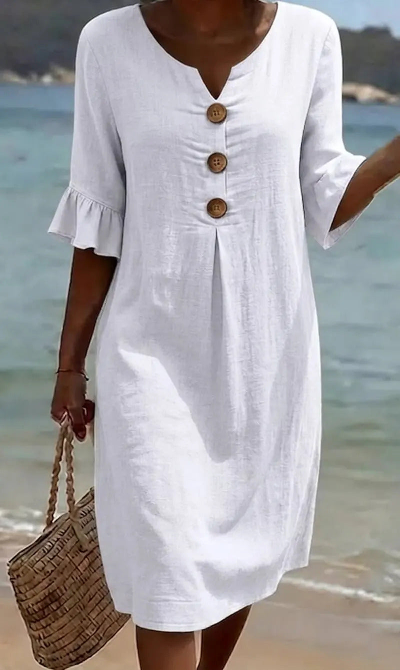 Back view of relaxed fit women's casual dress with flowy drape
