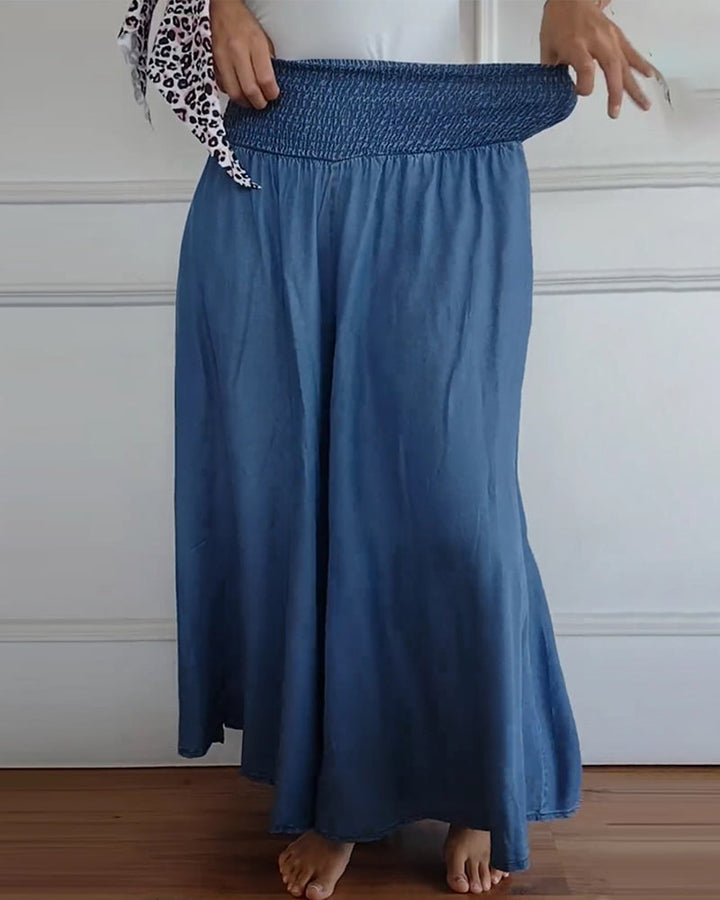 Close-up view of fabric texture and pocket detail on flowy summer skirt