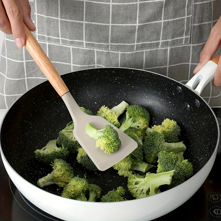 Flexible silicone slotted turner and spatula from a 12-piece utensil set