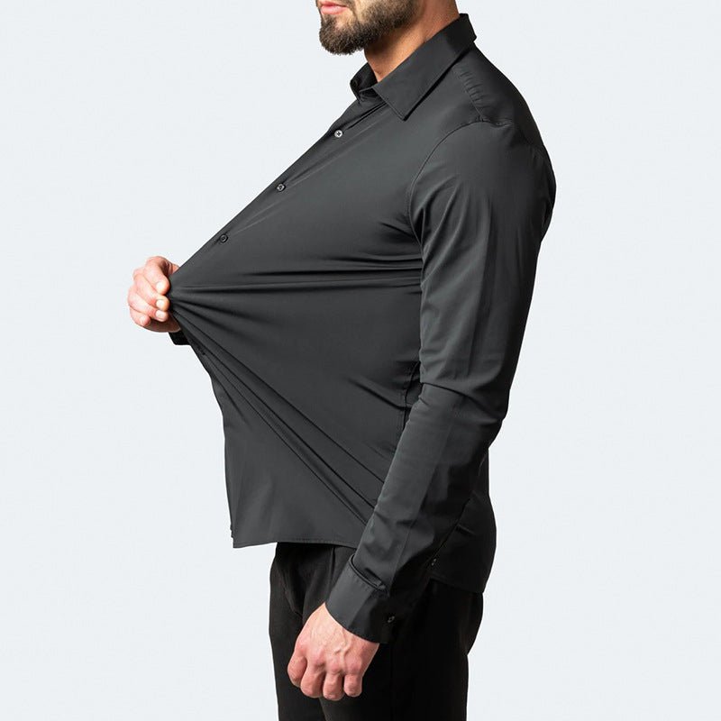 Side profile view of a man wearing a black stretch dress shirt