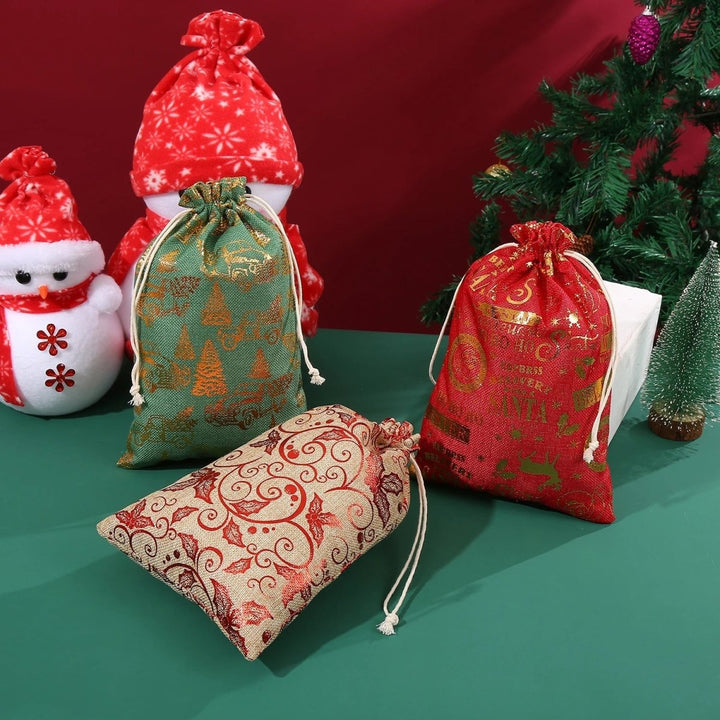 Collection of various sizes of reusable Christmas gift bags ready for holiday use