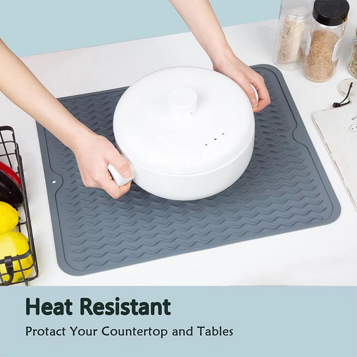 Compact silicone drying mat neatly placed next to the kitchen sink