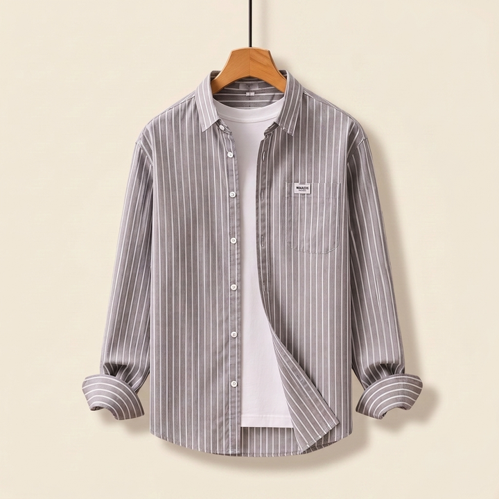 Close-up view of fabric and buttons on a men's smart casual striped shirt