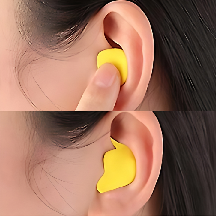 Close-up of yellow noise-isolating earplug fitting comfortably inside an ear
