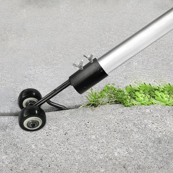 Rolling weed remover clearing weeds from a concrete pathway crack