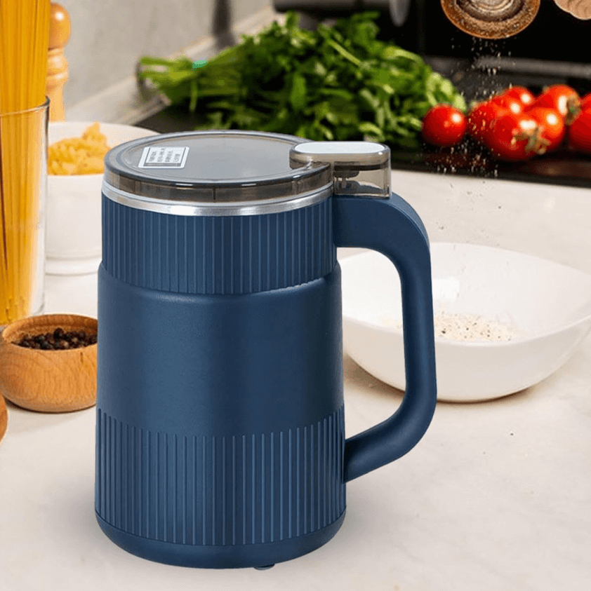 Blue electric grain mill on a kitchen counter with fresh ingredients