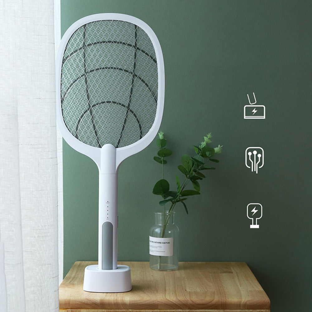 Handheld insect killer and bug zapper racket showing the safety mesh for home pest control