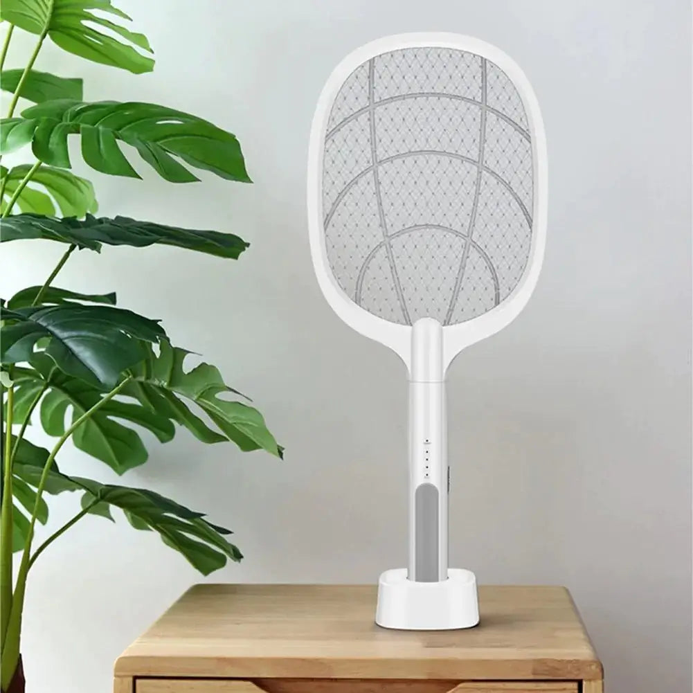 Wireless insect killer racket resting on a flat surface, highlighting modern pest control design