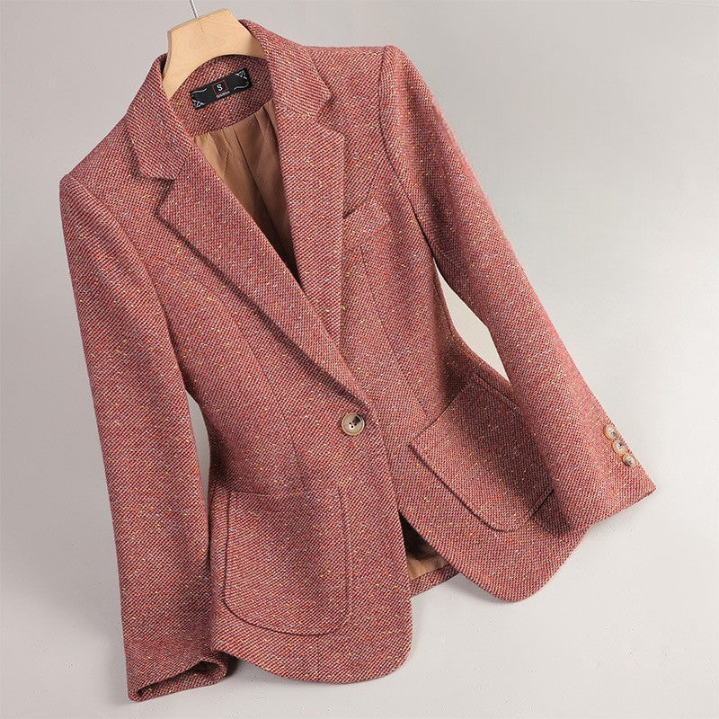 Rose tailored women's blazer jacket hanging on a wooden hanger