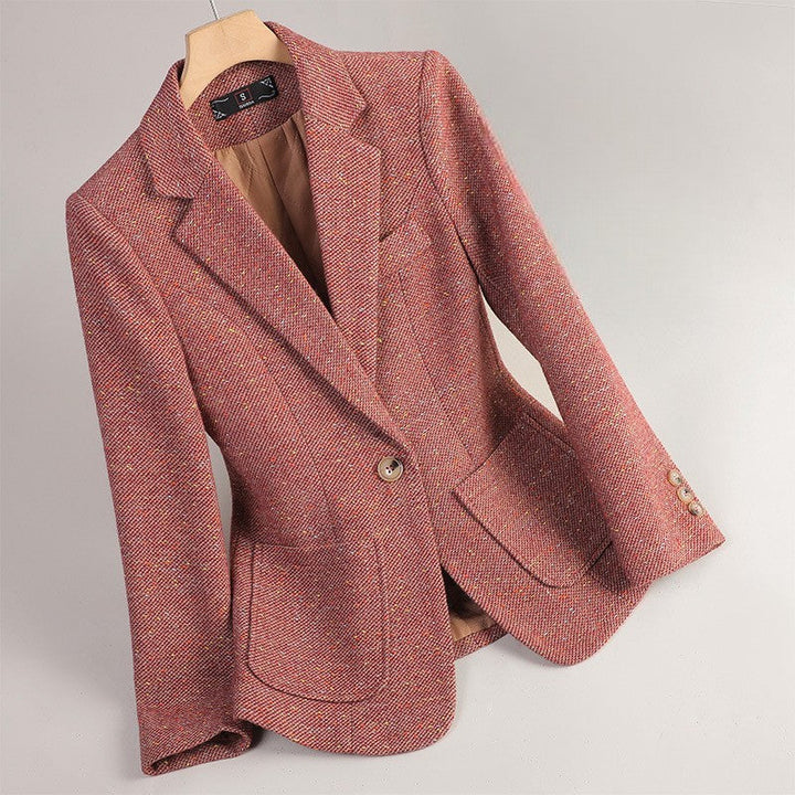 Rose tailored women's blazer jacket hanging on a wooden hanger