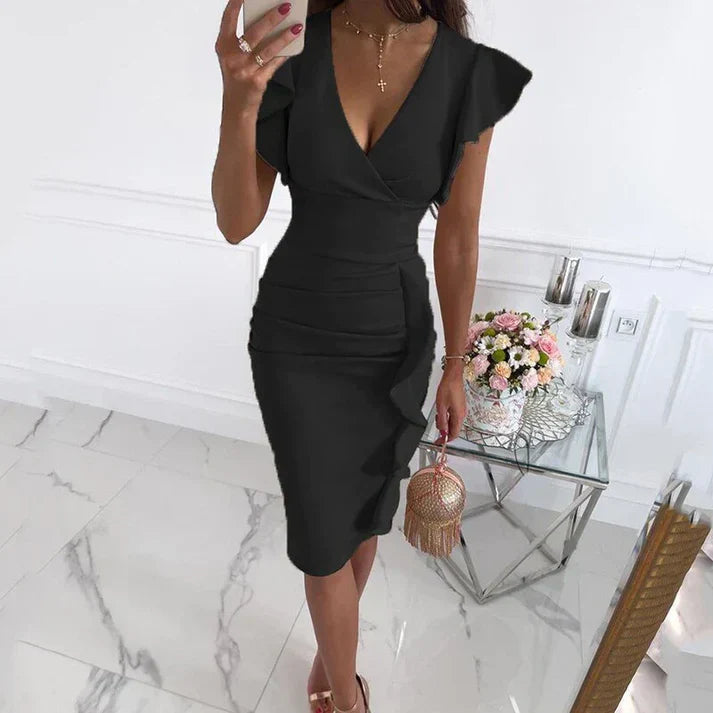 Woman wearing an elegant black summer maxi dress with ruffle sleeves