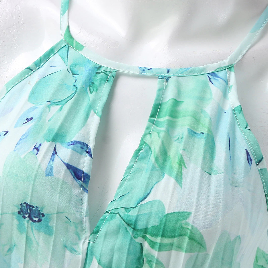 Close up fabric detail of the womens green floral vacation maxi dress