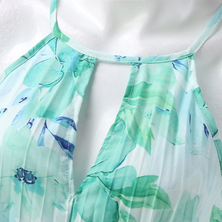 Close up fabric detail of the womens green floral vacation maxi dress