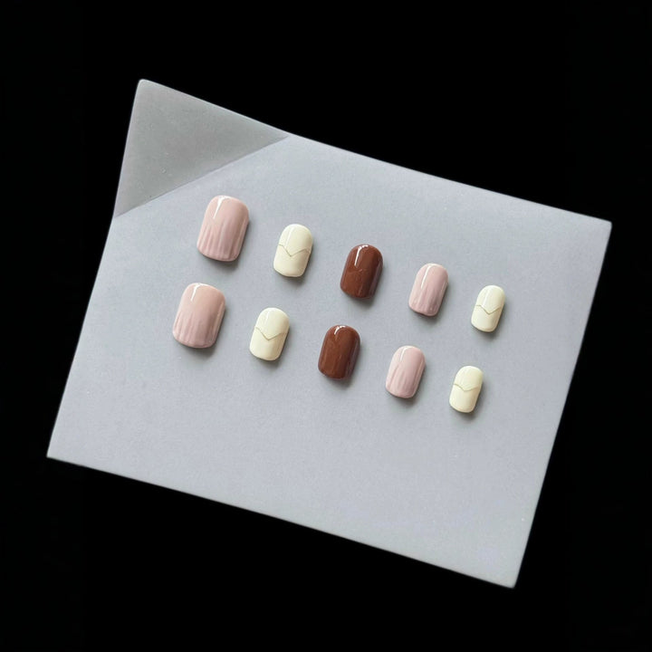 Neutral salon quality press-on nails with elegant nail art for women