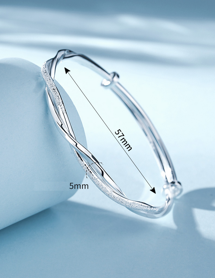 Stylish silver jewelry accessory for women displayed on a clean neutral background