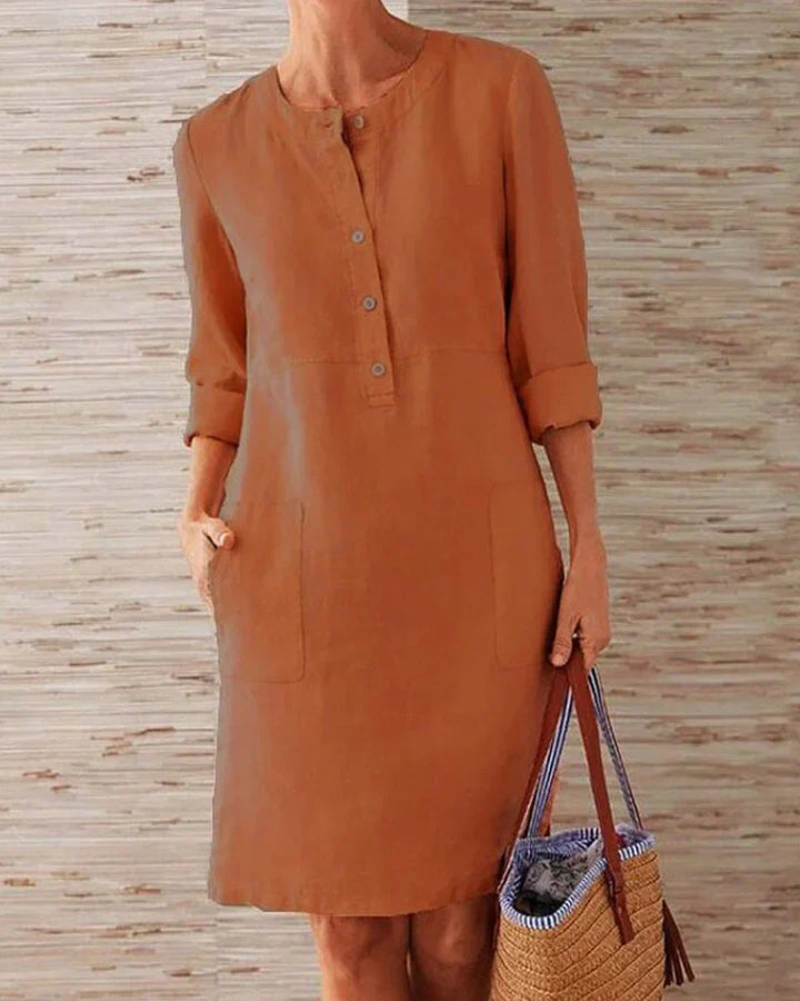 Women's elegant holiday wear dress showing button-placket closeup