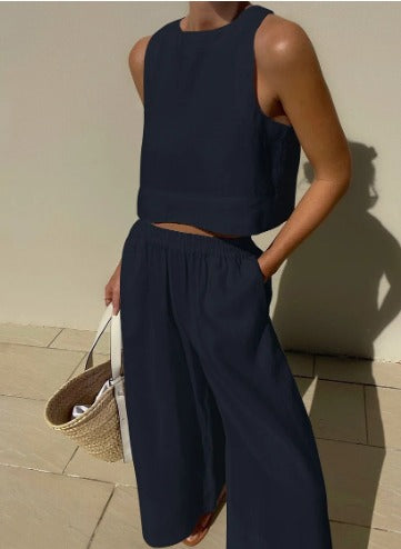 Side view of women's elegant two-piece trousers set showing chic matching fit