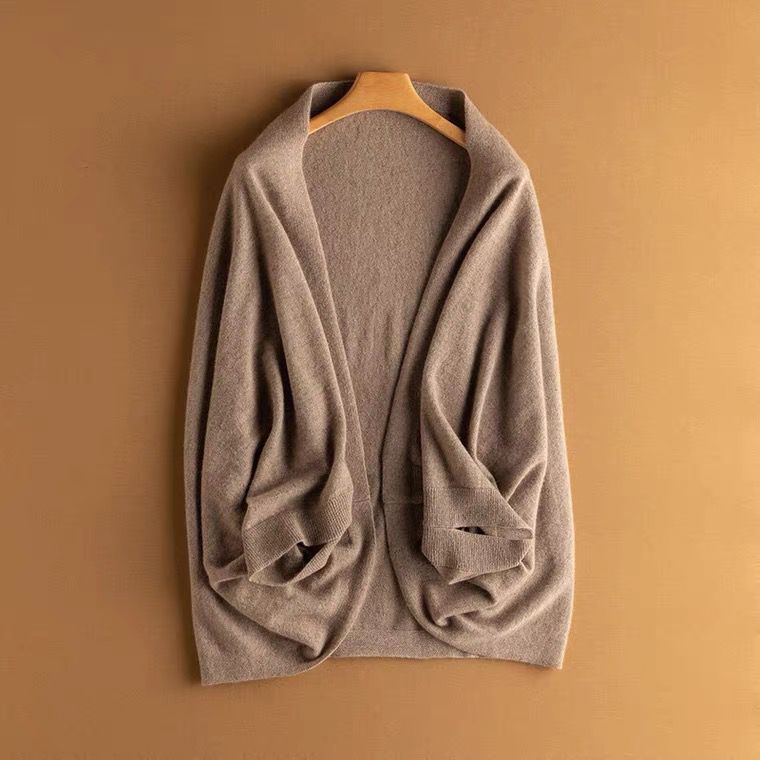 Stylish layering piece shown folded, highlighting the soft fabric of the womens fashion shawl