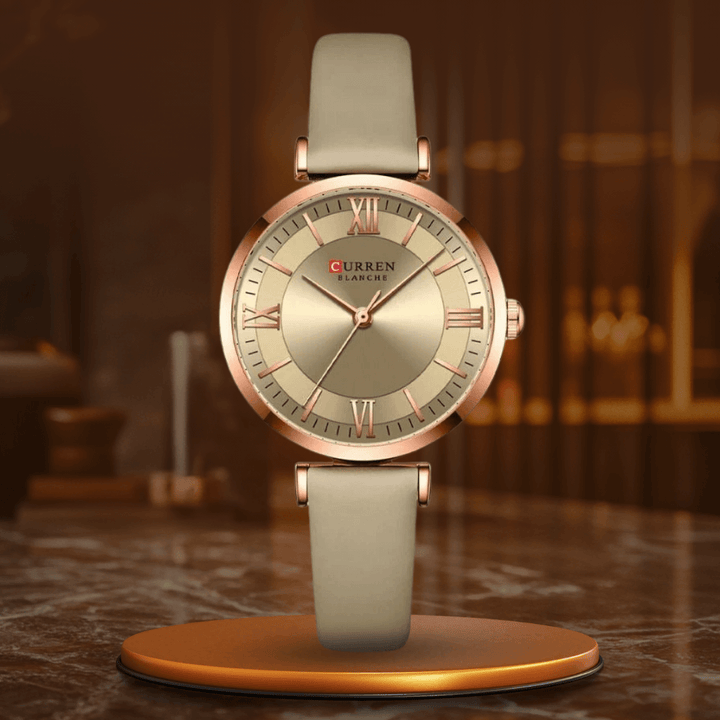 Women's elegant waterproof wristwatch closeup showing minimalist dial and hands