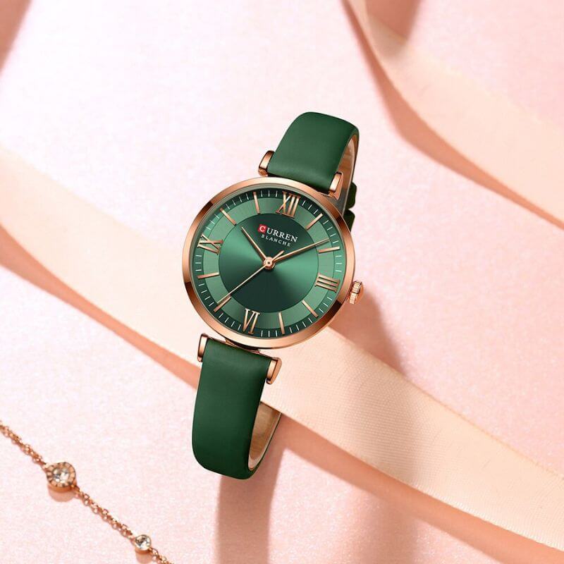 Fashionable women's quartz wristwatch angled to highlight polished bezel