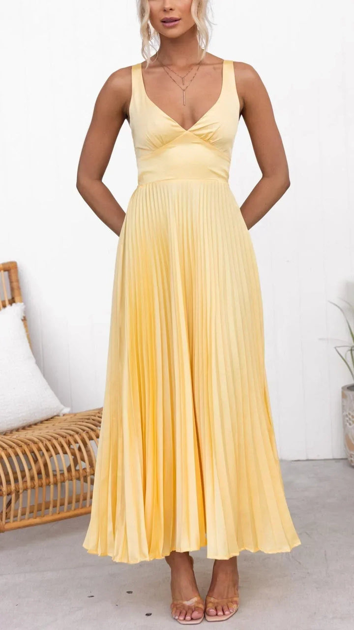 Front view of yellow pleated maxi dress with V-neckline