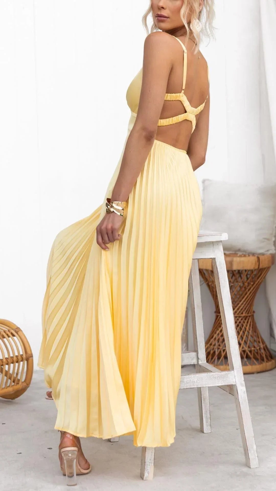 Elegant yellow pleated maxi dress with v-neckline for summer events