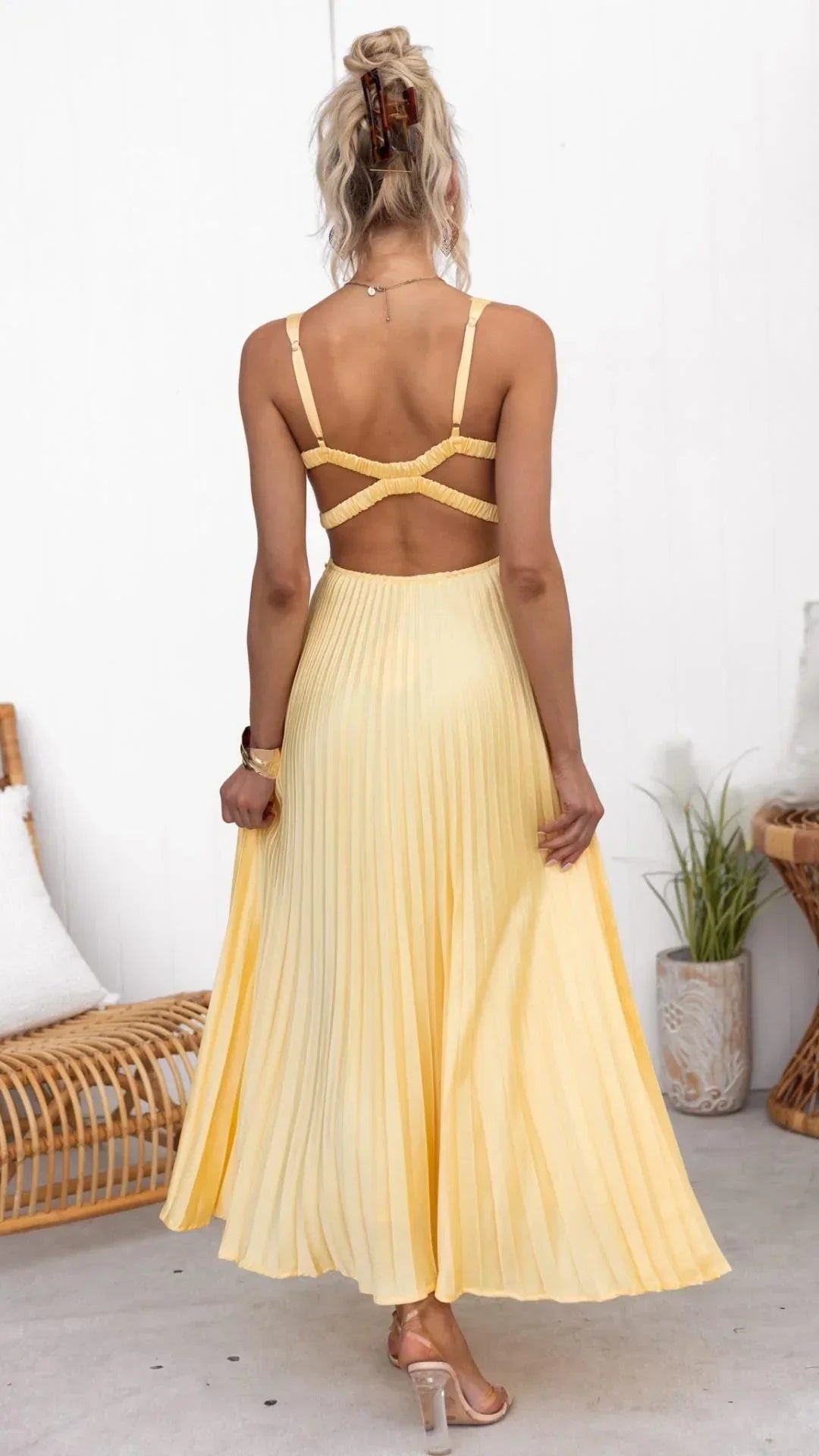Womens yellow v-neck party dress featuring pleated long maxi design